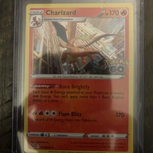Pokemon Charizard Card - Red and Yellow holographic